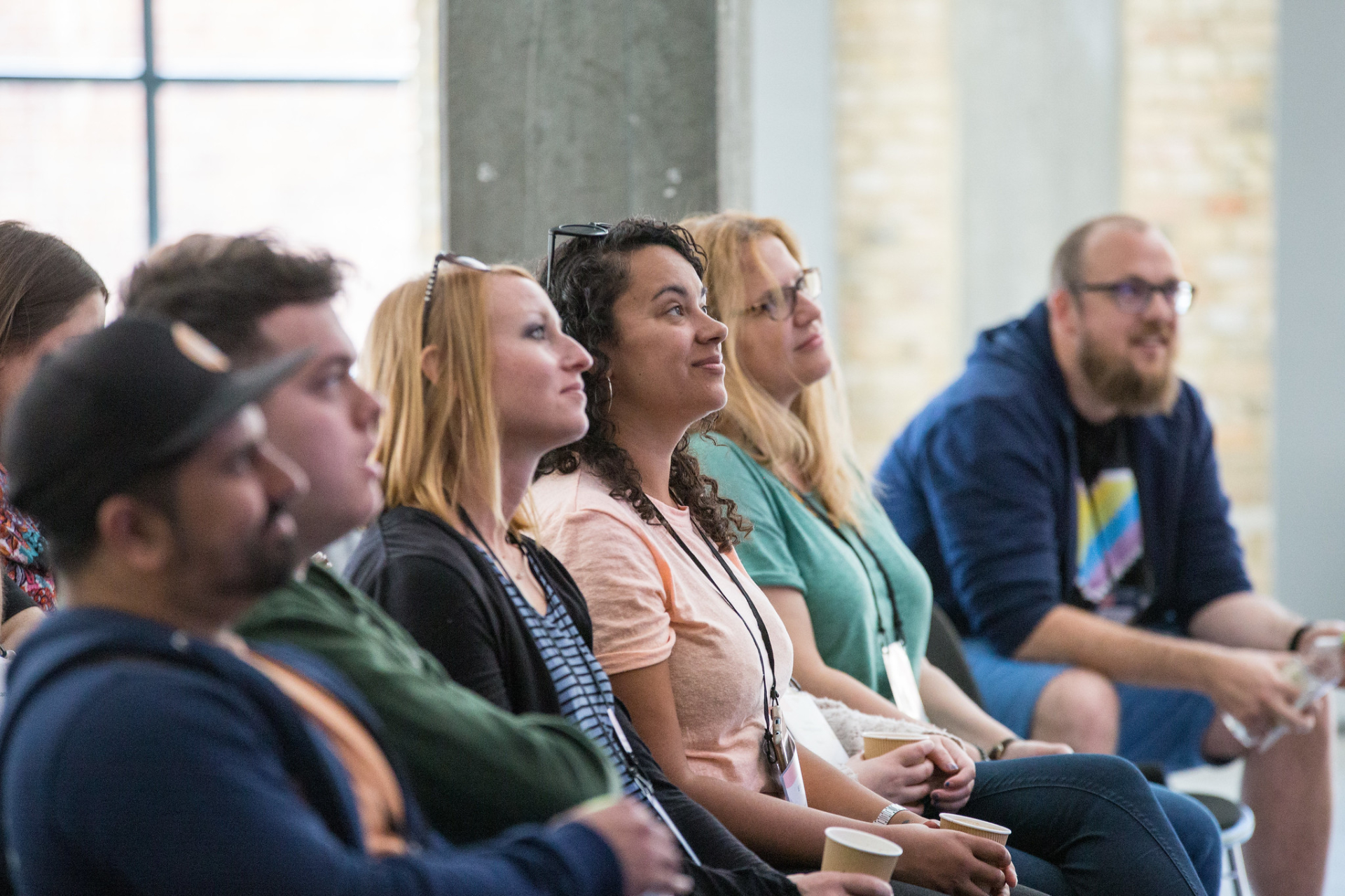 Members of the Umbraco community in the front row at a talk at Codegarden